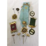 A small collection of Buffaloes medals, badges and pins.