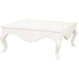 A large white country style wooden square coffee table with cabriole shaped legs.