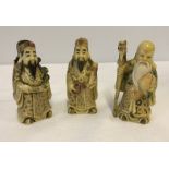 3 small Chinese figures.