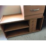 A vintage teak unit / coffee table on castors.