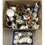 A box of assorted ceramics to include miniature shoes, bells and part tea sets.