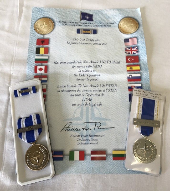 A NATO Meritorious Service medal together with an ISAF Service medal & certificate.