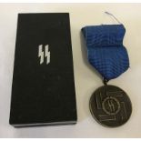 A boxed German SS 8 Year long service & good conduct medal.