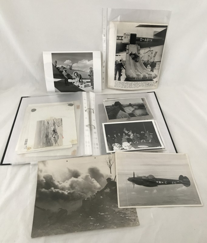 A folder containing a quantity of original military press photographs c1940' s to 1980's.