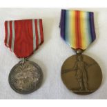 A scarce Japanese WWI Victory medal together with a Red Cross Service medal.