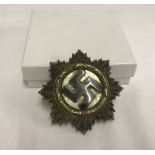 A German WWII Deutches Kreuz , No 1 (denotes Deschler & Sohn) stamped on pin.