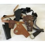 A box of holsters to include a concealed shoulder strap type.