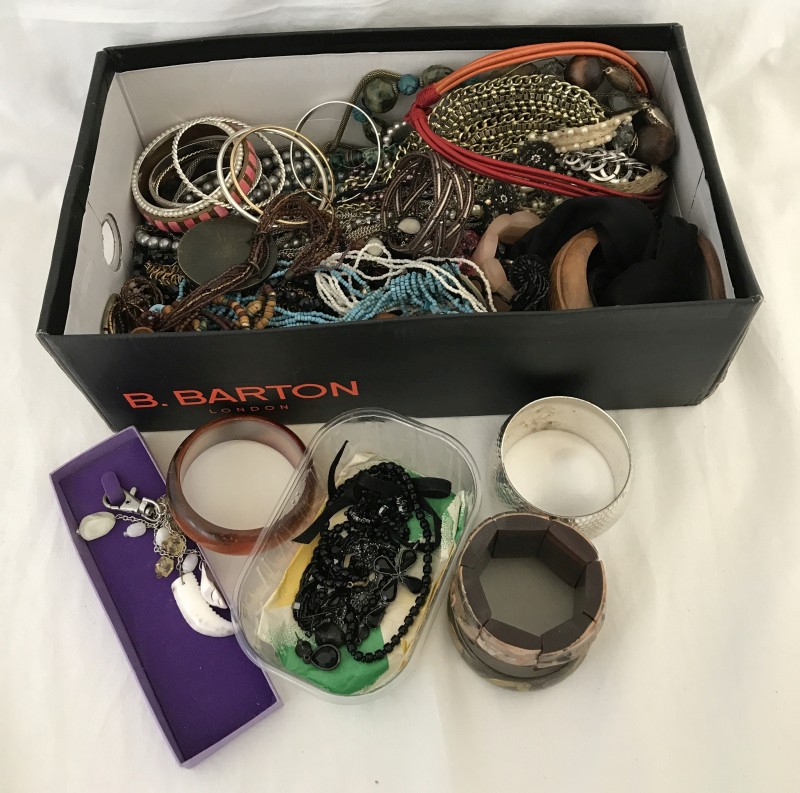 A box of mixed costume jewellery necklaces and bangles