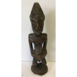 Vintage carved wood Yoruba fertility figure.