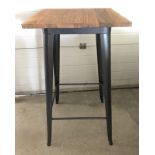 A modern poseur / bar table with pressed steel frame and solid elm wooden top.