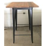 A modern poseur / bar table with pressed steel frame and solid elm wooden top.