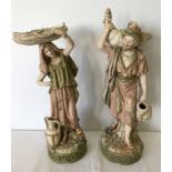 A large pair of Royal Dux Eastern style Water Carrier figurines.