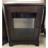 A solid wood dark oak small unit in Old Charm style. With glass front door.
