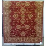 A Ziegler rug with red coloured background design.