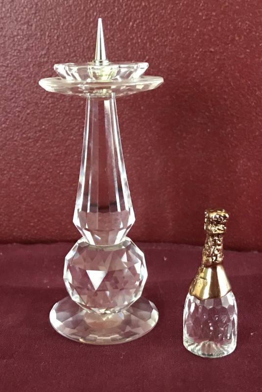 2 Swarovski crystal ornaments. A candle stick holder