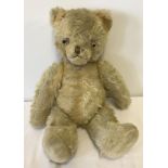 A vintage British blonde mohair teddy bear.