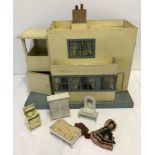 A vintage Tri-ang Ultra Modern No. 50 wooden front opening dolls house.