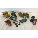 A collection of vintage Dinky construction vehicles, road signs, police & telephone boxes.