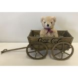 A boxed Franklin Mint wooden Coca-Cola cart with teddy bear.