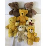 A collection of 7 small vintage teddy bears.