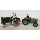 2 cast iron tractor figurines.