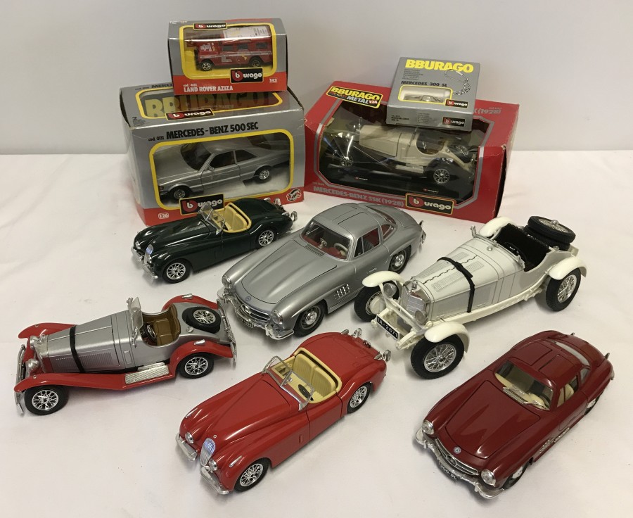 A box of boxed & unboxed Bburago cars.