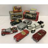 A box of boxed & unboxed Bburago cars.