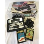 A c1970-80's Hanimex TVG-3000 Video Cartridge TV Game System with 2 games.