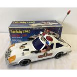 A boxed vintage Son A1 Toys battery operated Fairlady 280z Police patrol car.