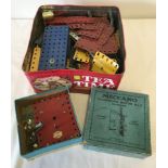 A tin of vintage Meccano together with a boxed Meccano Clockwork Motor No. 2.