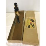 A boxed c1940-50's Tap Dancing Dinah wooden puppet.