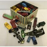 A tin of play worn diecast vehicles.