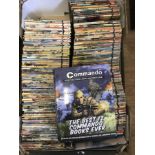 A box containing a large quantity of Commando war books.