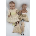 A collection of 4 vintage dolls.