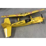 A large petrol engine radio controlled plane - Yellow coloured.