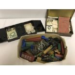 A collection of assorted small toys, cigarette cards, stamps and coins.