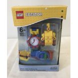 A boxed Lego Creator watch with building toy.