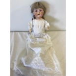 Antique bisque Armand Marseille doll with unusual lilac eyes.