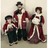 A set of 3 large Christmas shop display figures - Victorian carol singers.