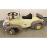 A metal bodied ride on Noddy car with steering mechanism.
