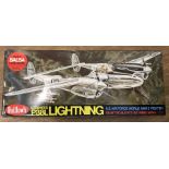 A boxed Guillow's Lockheed Lightning balsa wood plane kit.