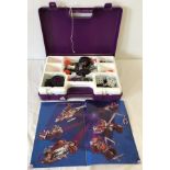 A modern Meccano play set in purple plastic carry case.