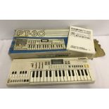 A vintage boxed Casio PT-30 electric keyboard with original operating manuals.