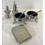 2 silver plated salts complete with blue liners and spoons.