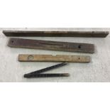 3 vintage wooden spirit levels together with a wooden folding ruler.