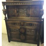 A carved oak Elizabethan style dresser.