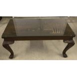 A 1960's coffee table with Chinese carved decoration of coastal fishing scene.