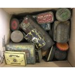 A box of vintage tobacco and cigarette tins.