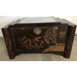A 1960's camphor wood chest with Chinese caved decoration.