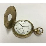 A vintage gold plated swiss made half hunter pocket watch.